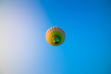 Big balloon flies against the sky