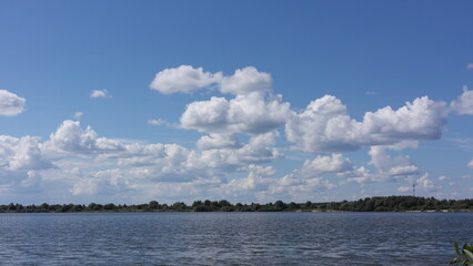 Naklejka na ściany i meble clouds over the lake