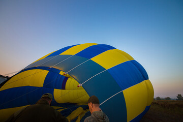 A large balloon lies on the ground
