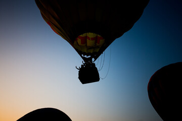 Hot air balloon at sunset in the sky