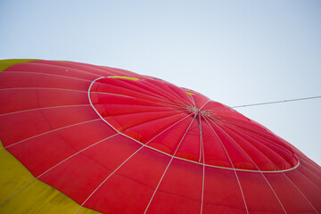 Big balloon flies against the sky