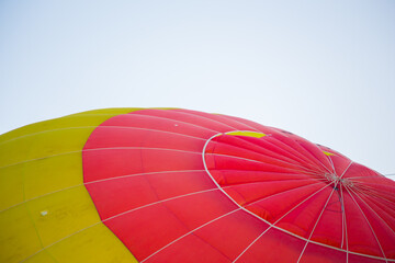 Big balloon flies against the sky