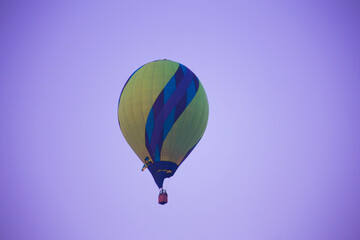 Big balloon flies against the sky