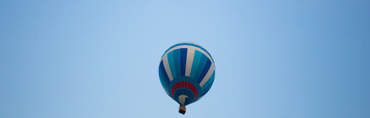 Fototapeta premium Big balloon flies against the sky