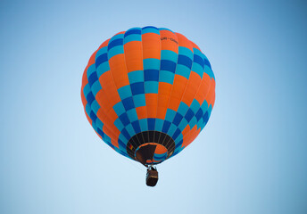 Big balloon flies against the sky