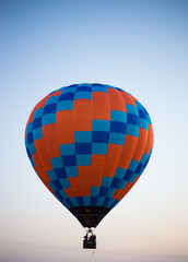 Big balloon flies against the sky