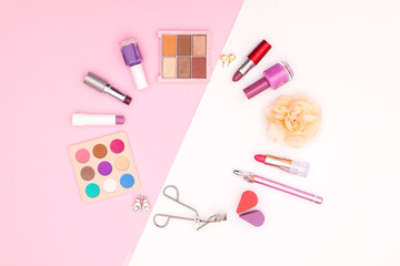 Obraz na płótnie Canvas Pastel make up products on pink theme 