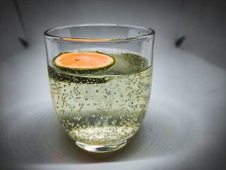 glass of lemon water with bubbles