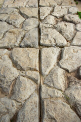Background of floor tiles or gray stone walls. Textured stone panel