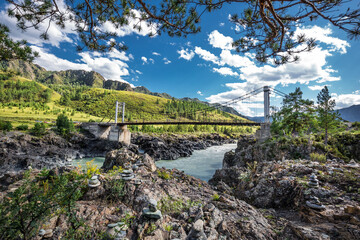 Mountain landscape with a bridge over the Katun river. Altai republic