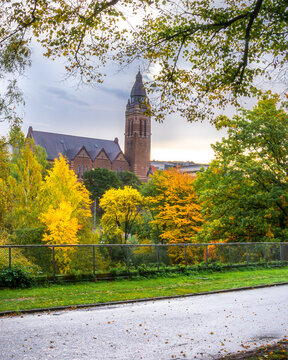 Annedalskyrkan in the middle of beautiful autumn colors as seen from slottsskogen gothenburg sweden