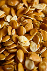 Close-up shot of pumpkin seed background. Vertical photo