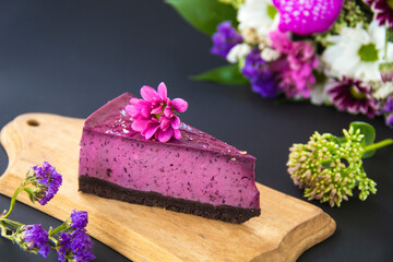 Obraz na płótnie Canvas Homemade cheesecake with fresh blueberries and mint for dessert - healthy organic summer dessert pie cheesecake. Creative atmospheric decoration.
