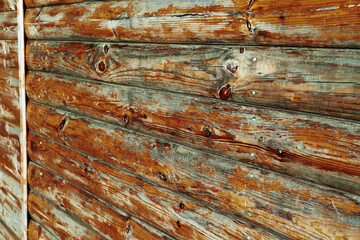 Obraz premium old weathered wooden planks as a brown background, peeling paint and cracks