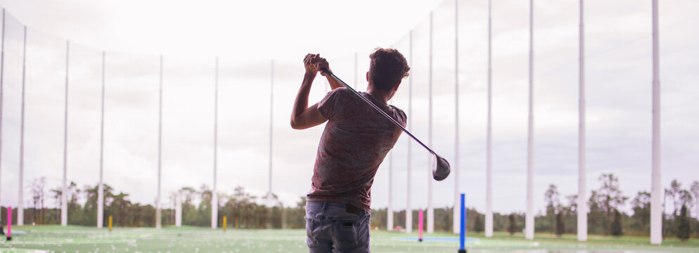 playing golf on a driving range 