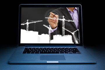 young manual worker displaying laptop over white background