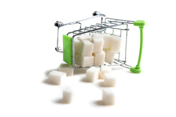 Miniature cart from the supermarket. Refined sugar. The problem of diabetes. The use of sugar.