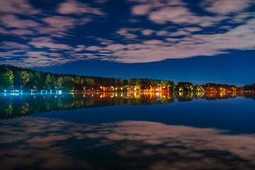 Fototapeta premium Moscow. August 27, 2020. Meshchersky pond. Beautiful night landscape with reflection of clouds on the surface of the water.