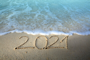 Fototapeta na wymiar New Year 2021 is coming concept on tropical beach.