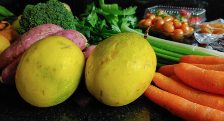 A small variety of fruits and vegetables that have just arrived from the organic fair.