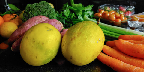 A small variety of fruits and vegetables that have just arrived from the organic fair.