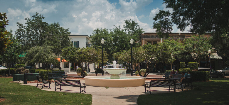 fountain in Winter Park is a city near Orlando, Florida. It’s known for its abundant outdoor spaces like leafy Central Park park avenue stock photo 