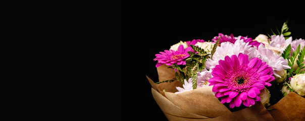 Ladge beautiful bouquet of Gerber flowers and hrisantem chrisantemus isolated on black background. Have a place for text and copy spase. 