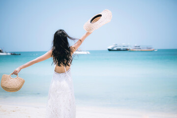 Yong woman dress white fashion dress walk realx on beach