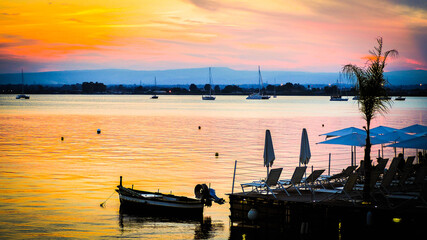 boats at sunset in sicily