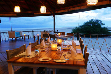Table set with love in the sea restaurant with a view of the sea and clouds