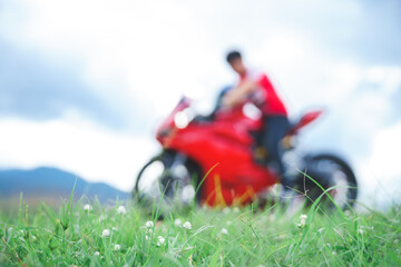 green grass field There are motorbikes parked far away.