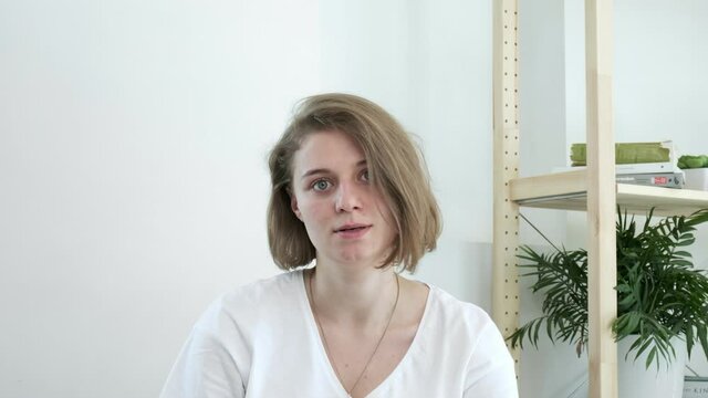 Mindblown reaction of upset millennial girl expressing shock. young caucasian woman in shocking situation, gesture of mind blown. She never expected this, she is annoyed, dissatisfied, disappointed