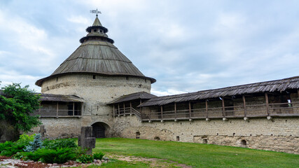 Pskov, Russia. Pokrovskaya tower. complex of fortifications. Pokrovskaya tower near with an ancient temple and crosses