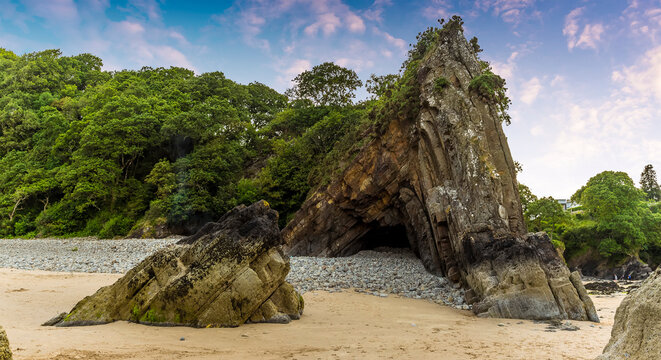 Ladies Cave on the Glen Beach, Saundersfoot, Wales at low tide in  summer; a spectacular example of an anticline