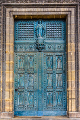 Church of Saint-Vincent-de-Paul (Eglise Saint-Vincent de Paul, built in 1824 - 1844), dedicated to Saint Vincent de Paul. Fragments of the entrance, door sculpture. Paris, France.