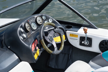 Controls and gauges on a speed boat dashboard