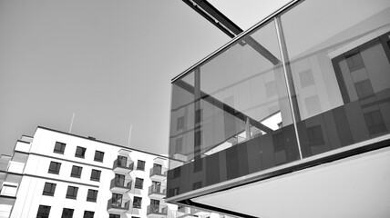 Fototapeta premium Detail of modern residential flat apartment building exterior. Fragment of new luxury house and home complex. Black and white.