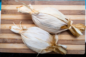 Couple of small tamales called Chuchitos, traditional Guatemalan cuisine, a source of protein carbohydrates.