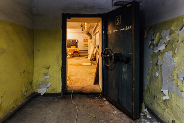 Opened heavy steel armored hermetic door in the Soviet bomb shelter