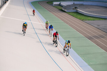 Kyiv, Ukraine 27.08.2020 - A man rides a bicycle on a track stadium