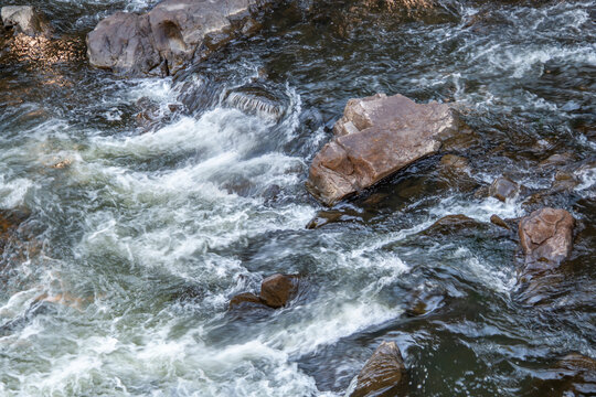 Rushing Blue Water Through A River