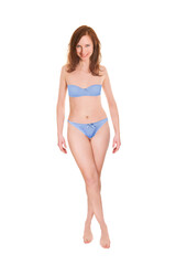 Fototapeta premium Full length portrait of an attractive woman wearing blue bra and panties, isolated in front of white studio background
