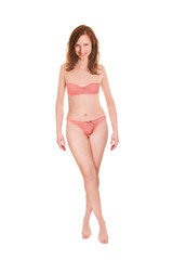 Full length portrait of an attractive woman wearing red bra and panties, isolated in front of white studio background
