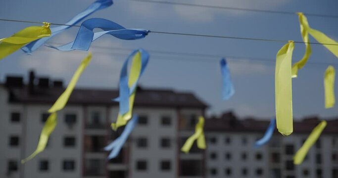 Blue-yellow ribbons develop in the air. Ukraine flag