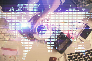 Double exposure of man and woman working together and business theme hologram drawing. Computer background. Top View.