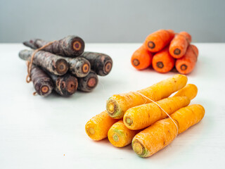Variety of Purple, Yellow and Orange Carrots Tied Together