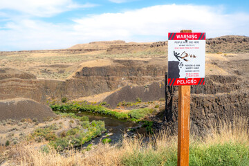 A warning that people have died here at the trail path above the Palouse Falls at the Palouse Falls State Park in the Inland Northwest of Washington