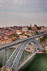 European Travel Places. Porto Cityscape at Daytime with Dom Luis I Bridge in Foregounrd in Portugal.
