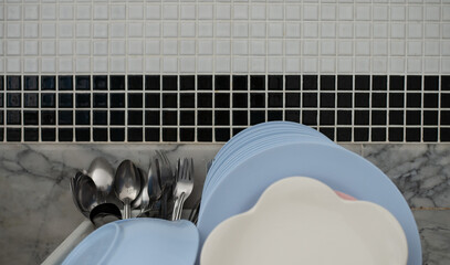 plates on drying board at the kitchen.