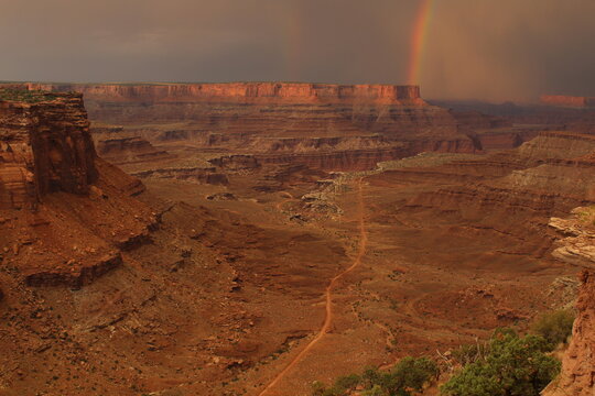 Rare view of a double rainbow during a thunderstorm at sunset in Canyonlands National Park, Utah. Views only comparable to Mars © Austin